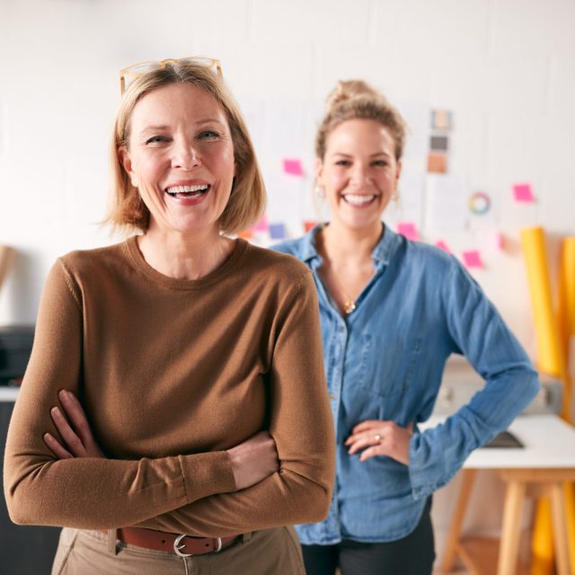 Portrait Of Two Women Running Creative Business In Studio Together